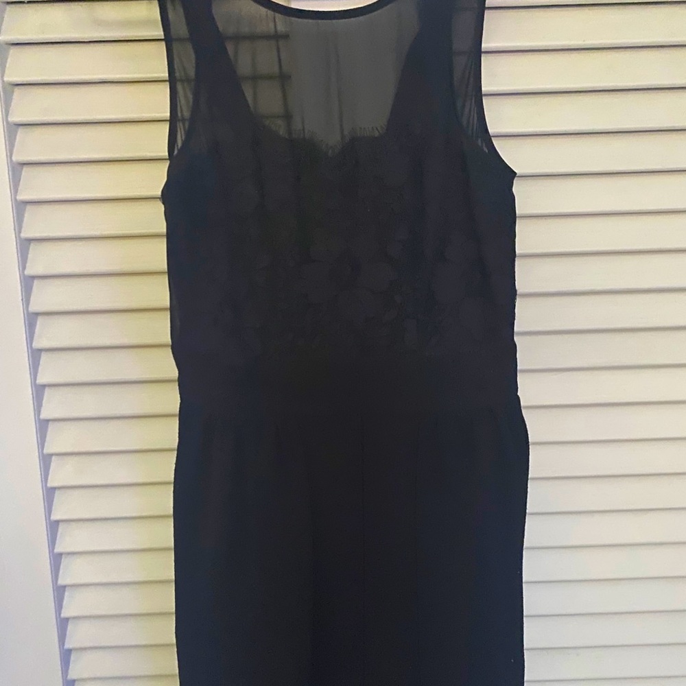 Black cocktail dress with lace accents